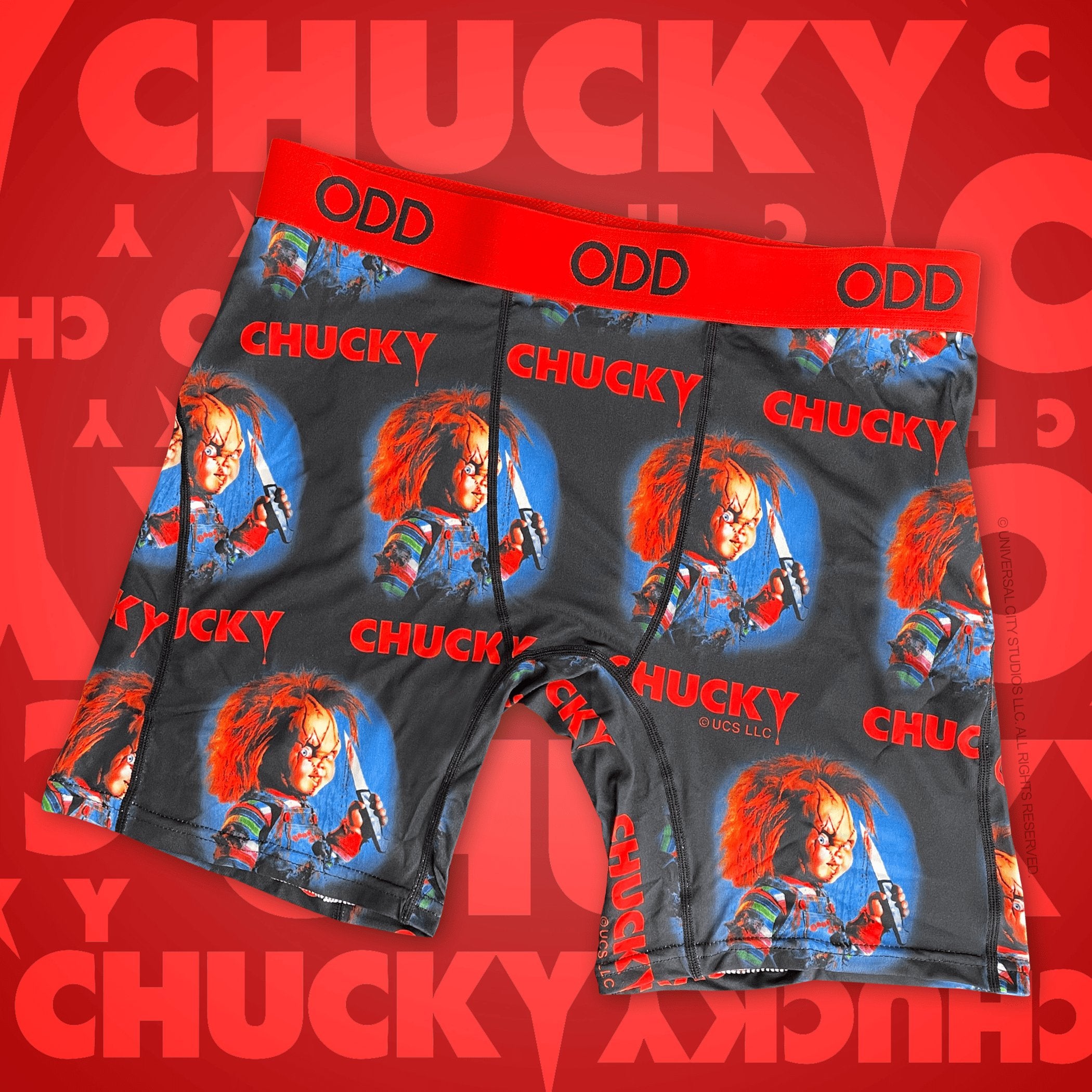Dark gray boxer briefs showcasing Chucky's iconic horror movie character. The waistband is red with "ODD" branding, repeated images of Chucky holding a knife.