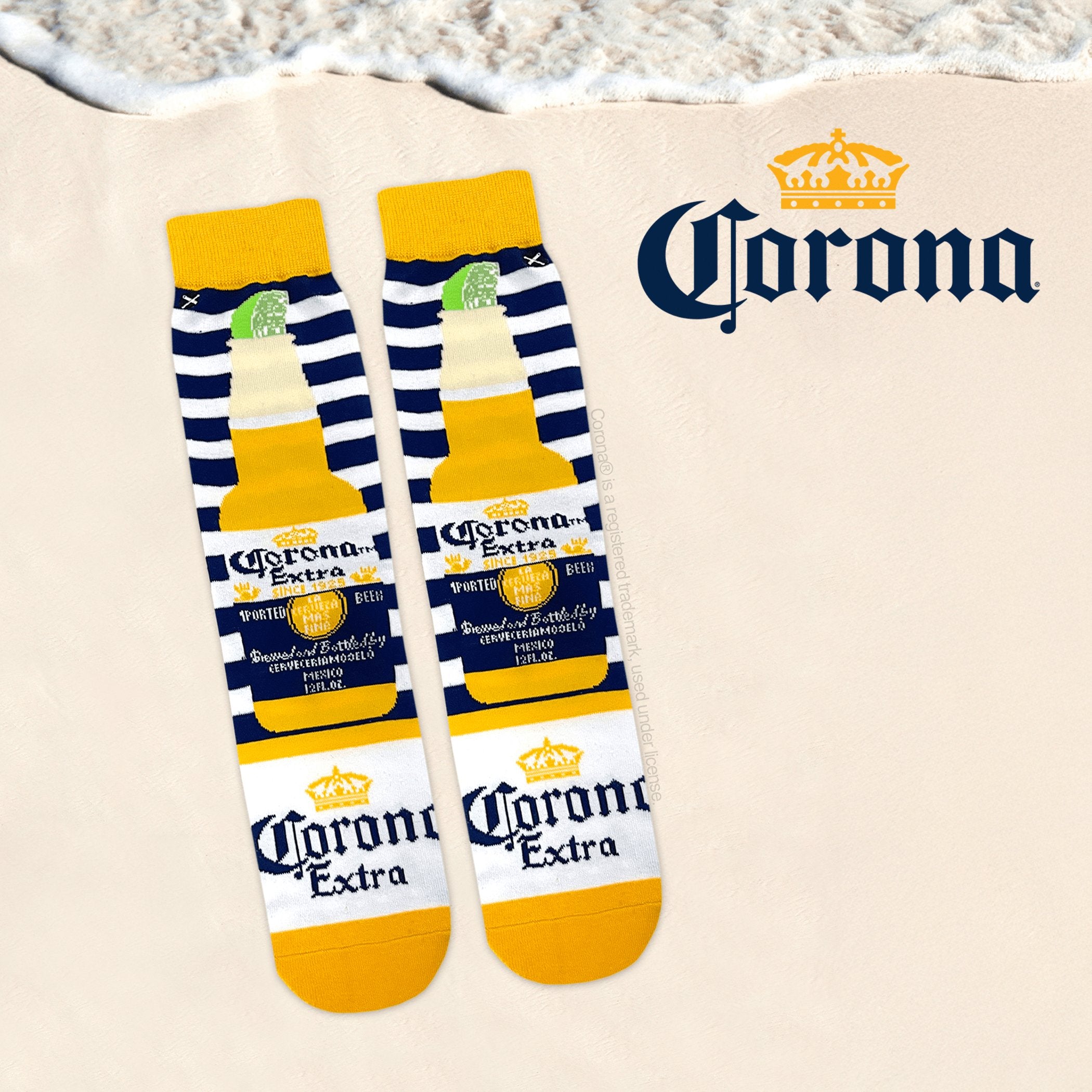 Relaxed beach-themed background with Corona socks displaying the classic beer bottle design with a slice of lime, capturing a tropical, laid-back vibe.