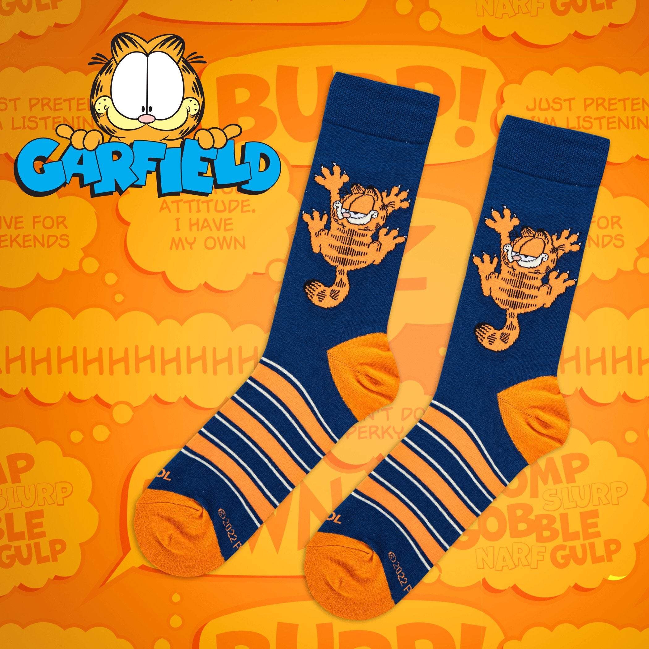 Orange background with speech bubbles featuring Garfield sayings, showcasing socks with Garfield in his classic mischievous pose, capturing the humor of the comic strip.