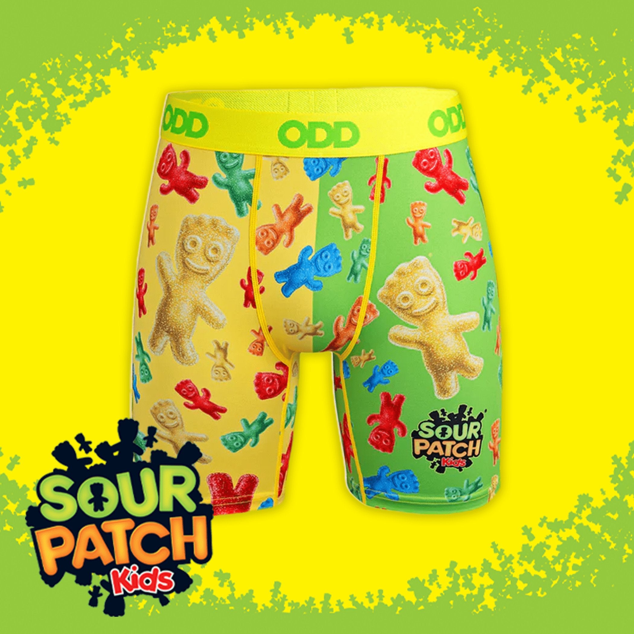 Vibrant boxer briefs featuring multicolored Sour Patch Kids candies on a yellow-green background. Bright yellow waistband with "ODD" text. Sour Patch Kids logo displayed in the bottom left.
