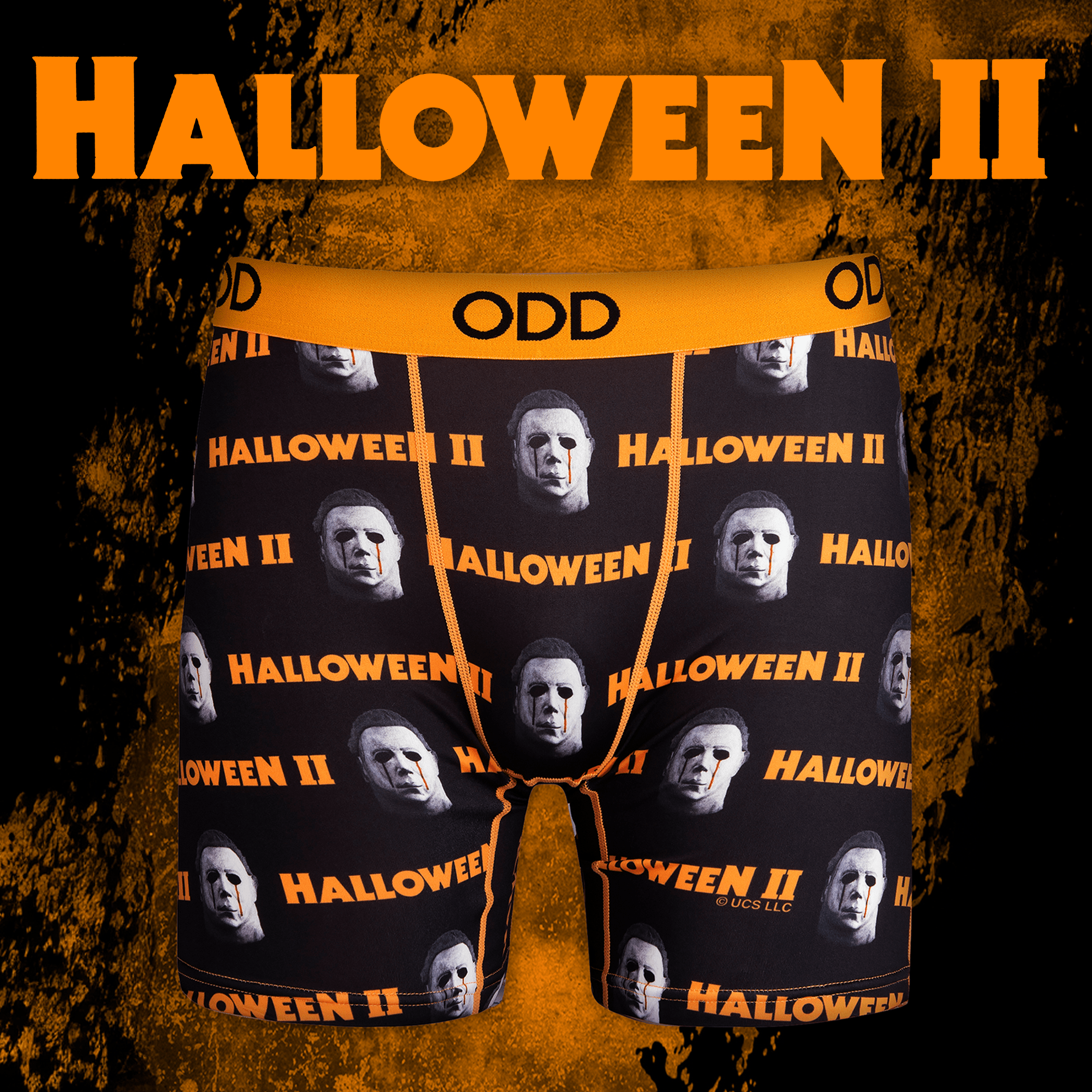 Halloween II-themed boxer briefs with Michael Myers' face and text, against a black and orange textured background.