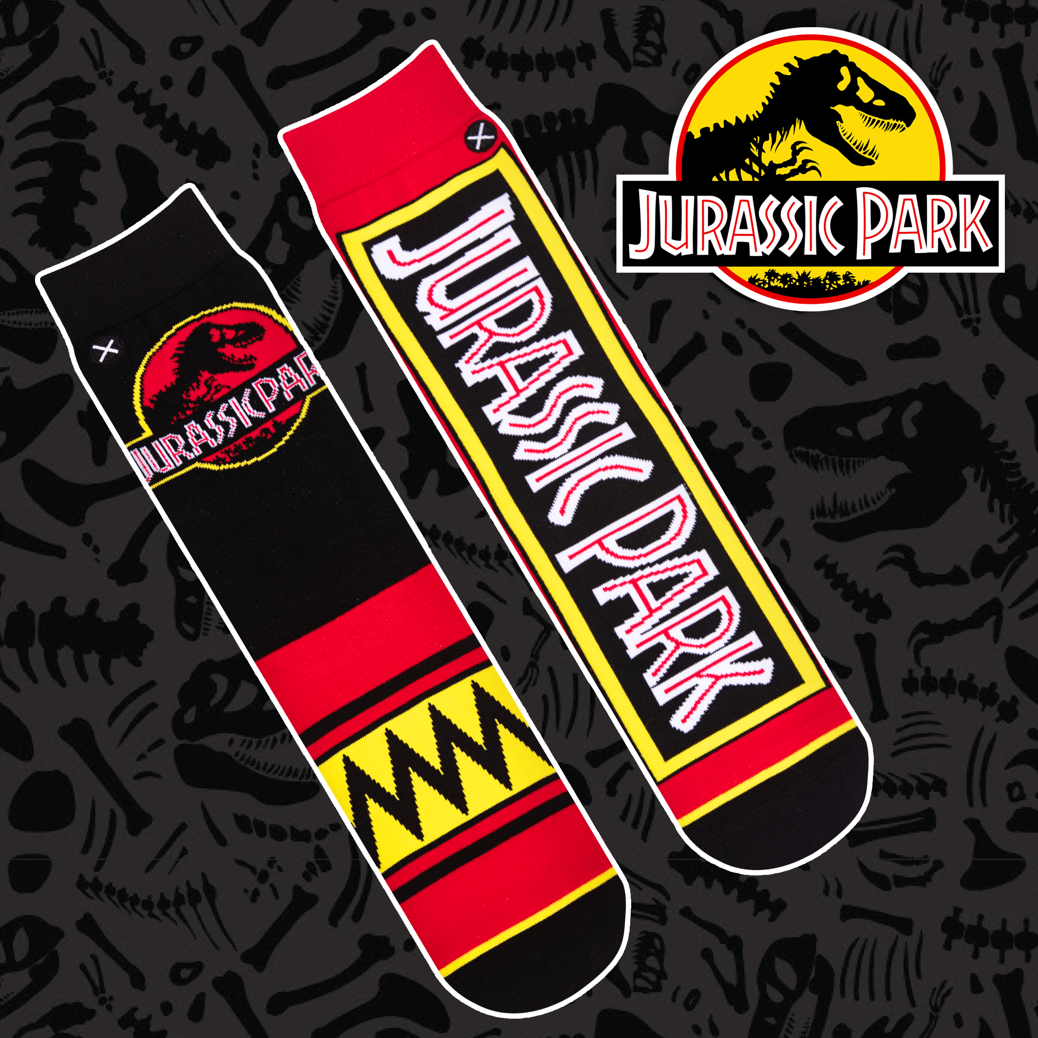 Black socks with red, yellow, and white accents showcasing the iconic Jurassic Park logo and dinosaur patterns.