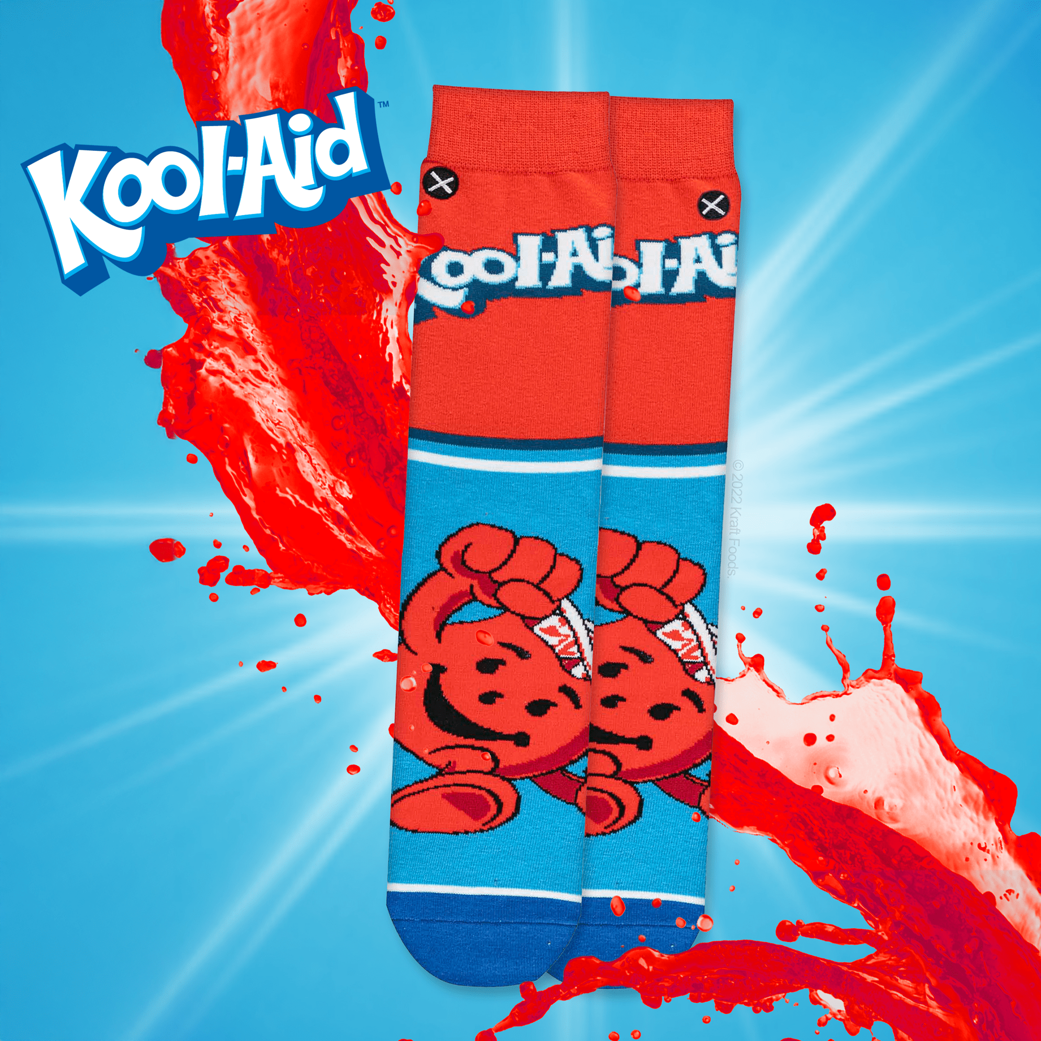 Red and blue socks featuring the Kool-Aid Man with playful splash effect. Kool-Aid logo displayed in the top left.