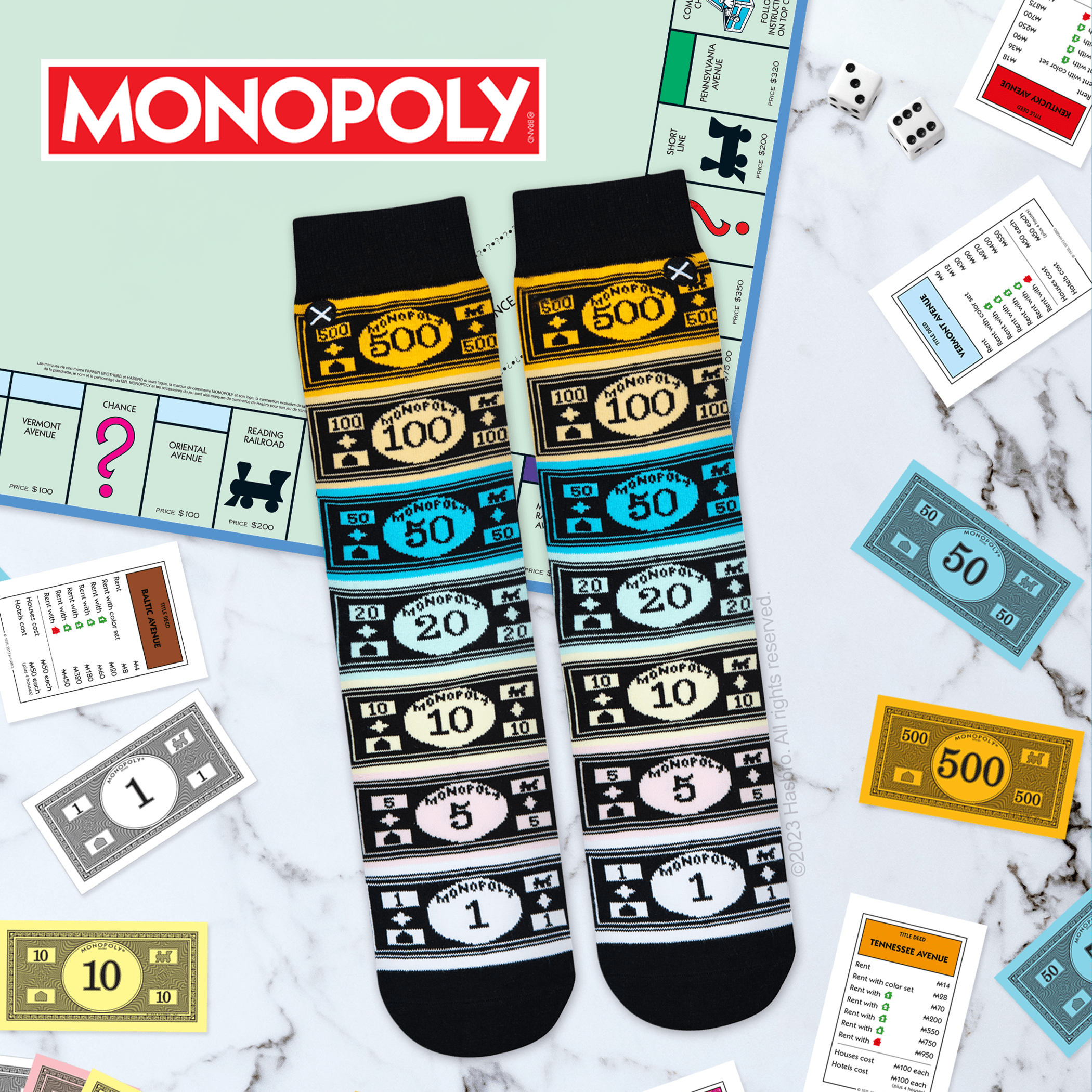  Board game-themed background with Monopoly socks designed with various denominations of Monopoly money, ideal for game enthusiasts.