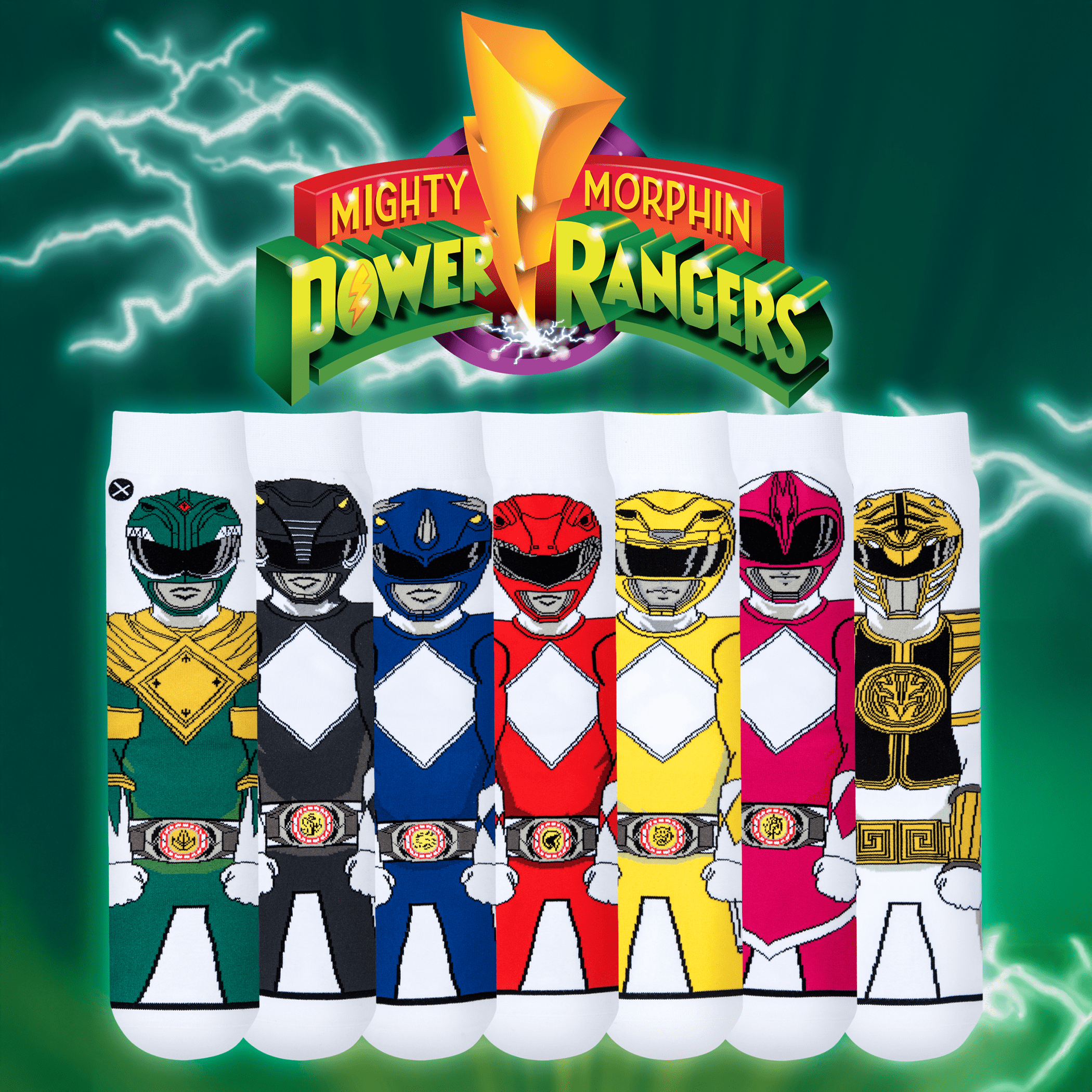 A collection of socks depicting Mighty Morphin Power Rangers in their iconic suits: Green, Black, Blue, Red, Yellow, Pink, and White. The Power Rangers logo is displayed above, with a green lightning background.