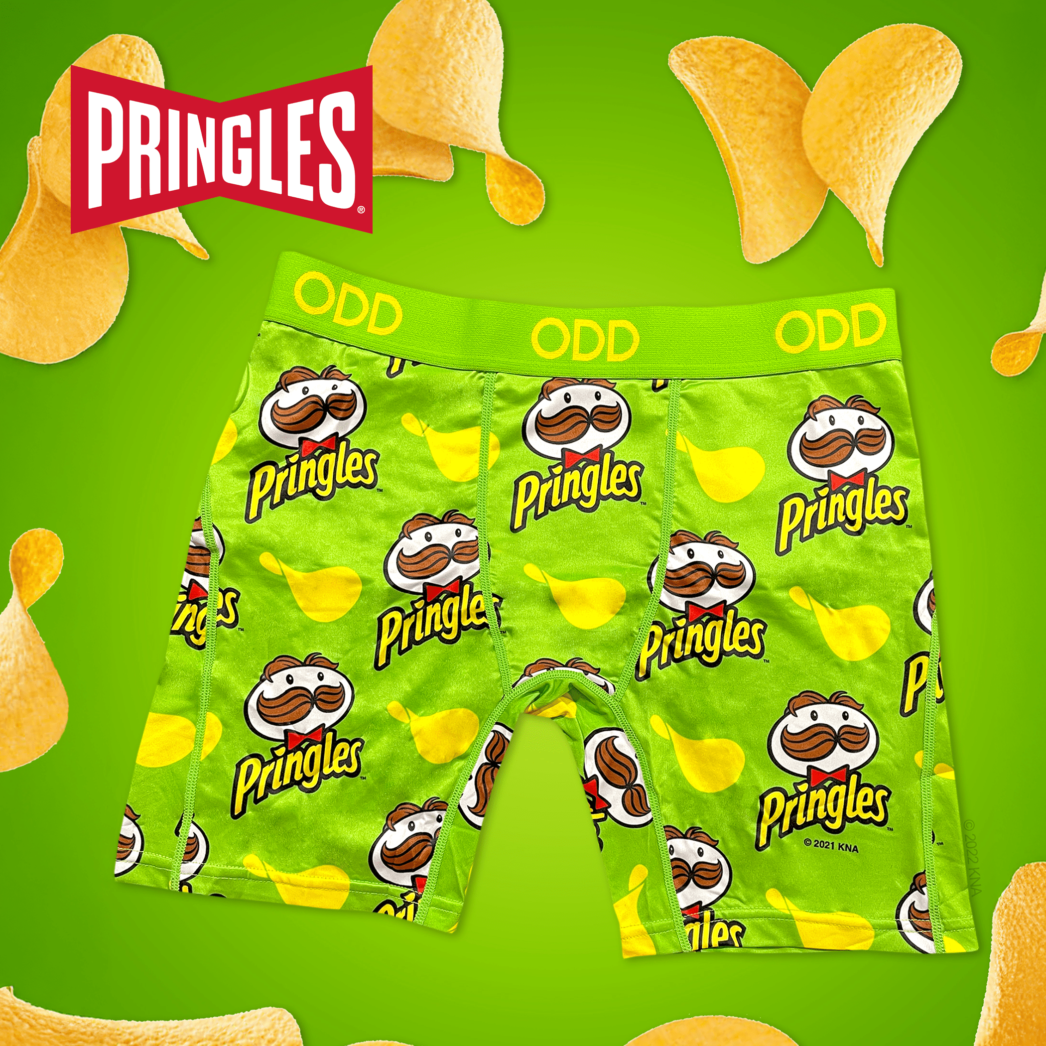 Green background with Pringles chips and Pringles-themed boxer briefs, decorated with the iconic Mr. Pringle logo, embodying the playful snack.