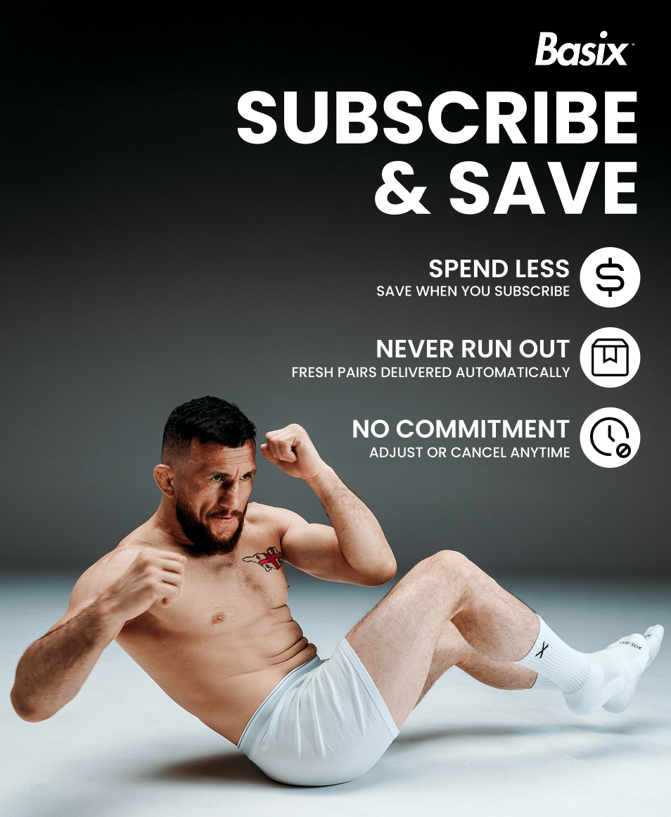 Man sitting on floor wearing white underwear and socks with Basix subscription service advertisement text.