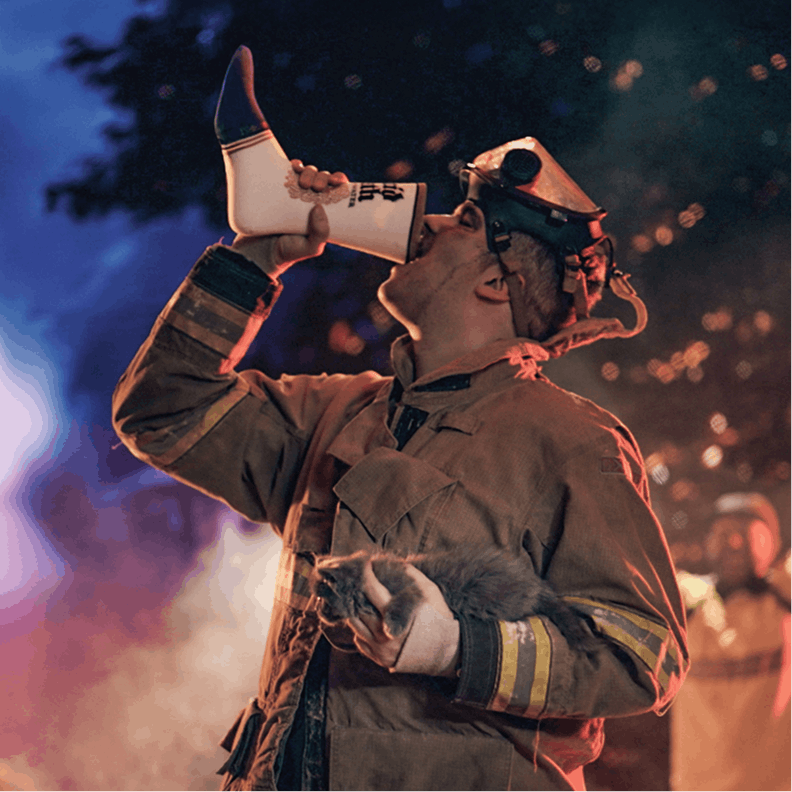 Firefighter using a megaphone with a blurred background