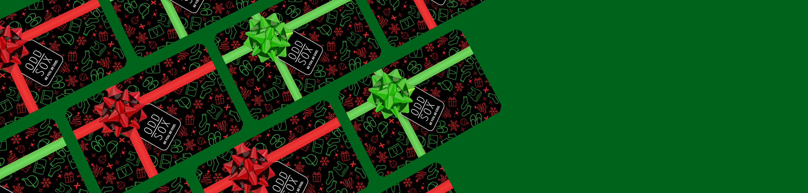 Gift boxes with red and green ribbons on a green background