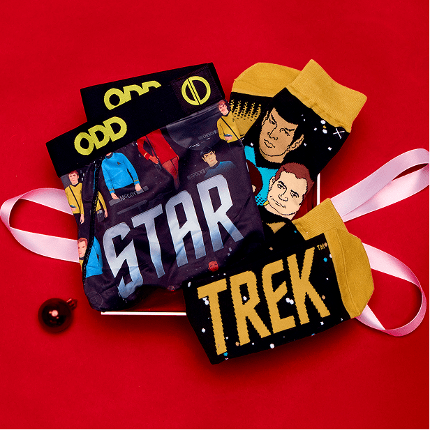 Star Trek-themed socks with packaging on a red background