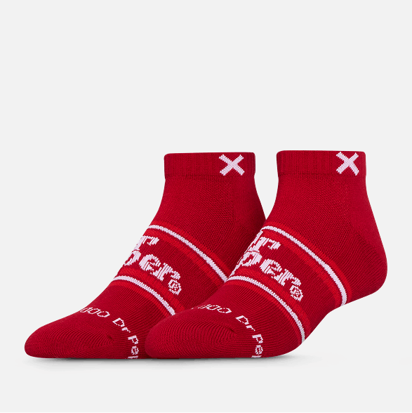 Red socks with white branding on a light gray background