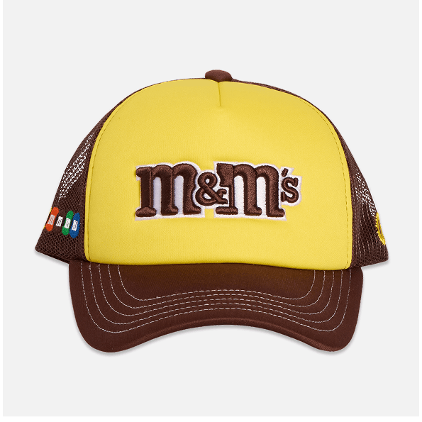 Yellow and brown cap with M&M's logo on a white background