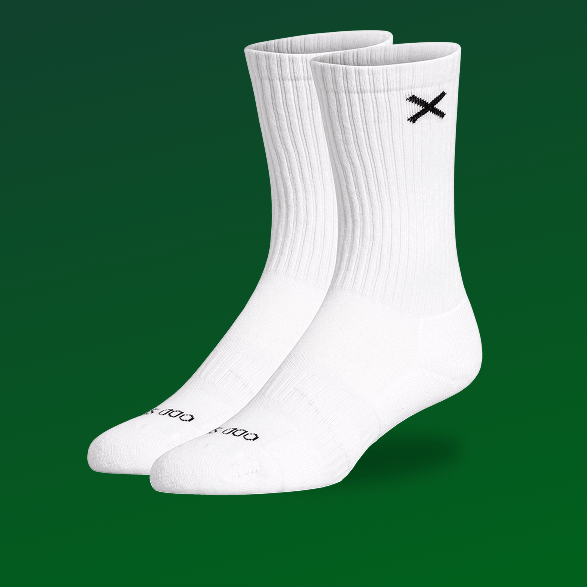 White socks with a black logo on a green background