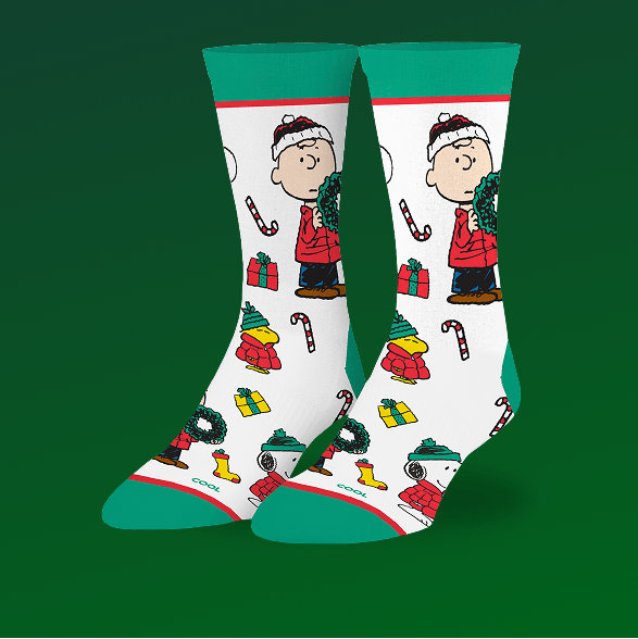 Pair of Christmas-themed socks with cartoon character on a green background