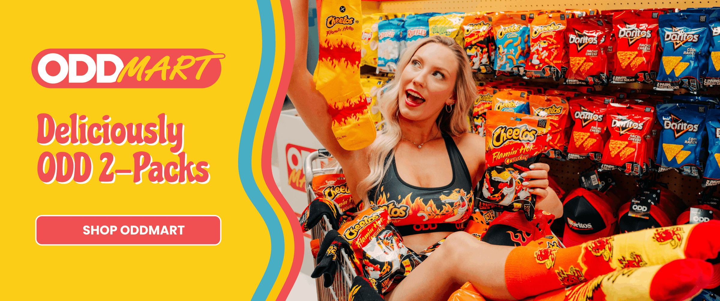 Woman holding Oddly Delicious 2-Packs with Odd Mart branding in the background