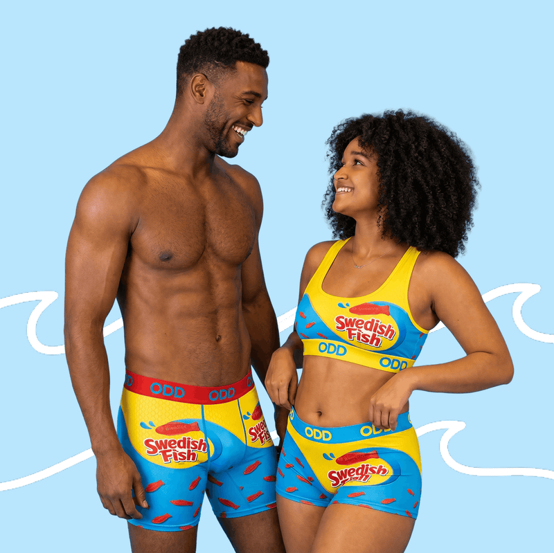 Man and woman wearing Swedish Fish-themed underwear against a blue background