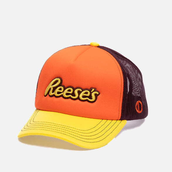 Orange, yellow, and black cap with 'Reese's' logo on a white background